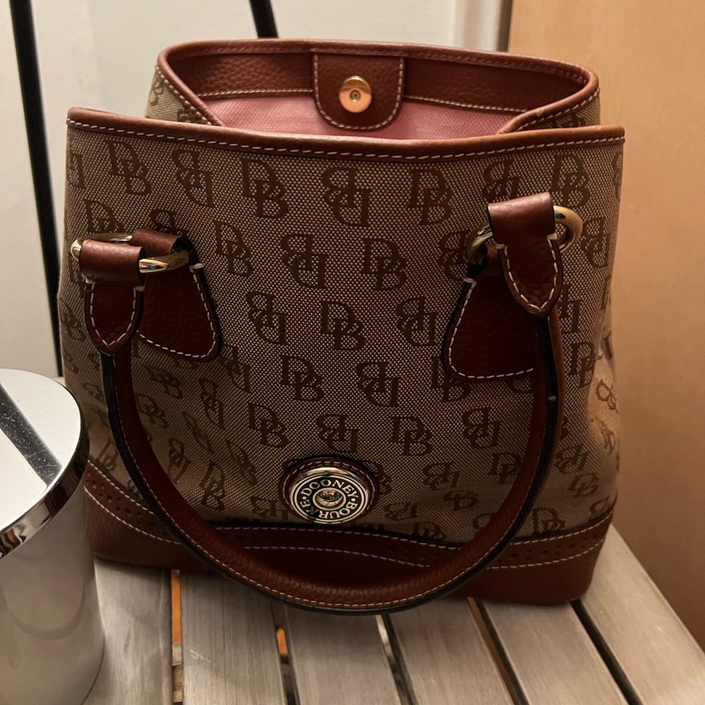 Beautiful Dooney and Bourke‘s is still brand new and barely used.